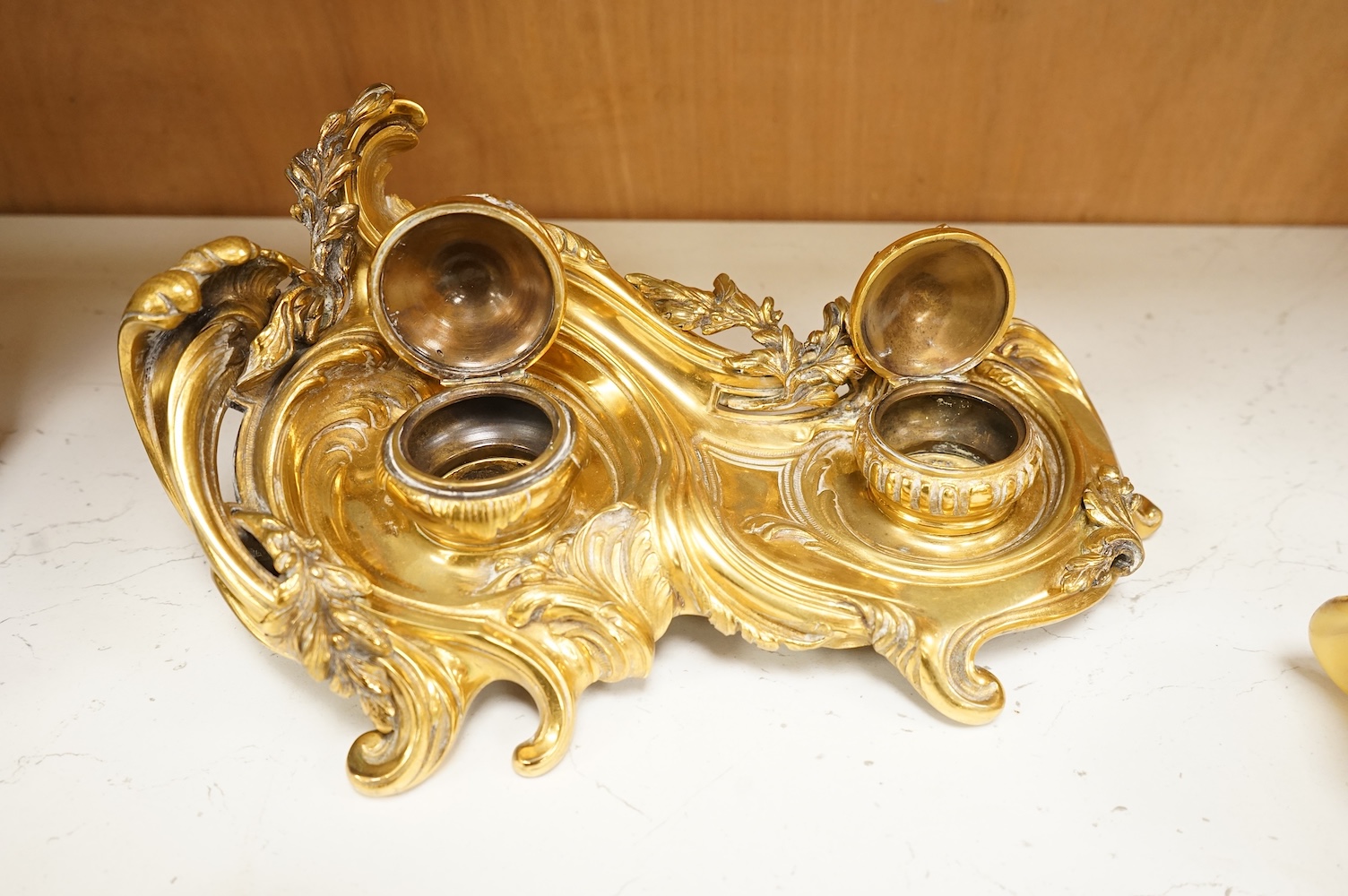 George Van de Voorde (Belgian, 1878-1970), an early 20th century rococo revival gilt bronze twin ink stand, 29cm wide